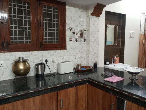 a kitchen with a counter top and a sink at EnDai House - Kalyanpuri, Uppal in Hyderabad