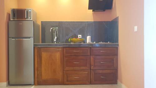 Η κουζίνα ή μικρή κουζίνα στο Auberge de l'Oasis