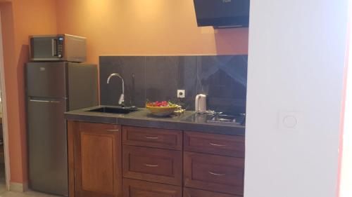 Η κουζίνα ή μικρή κουζίνα στο Auberge de l'Oasis