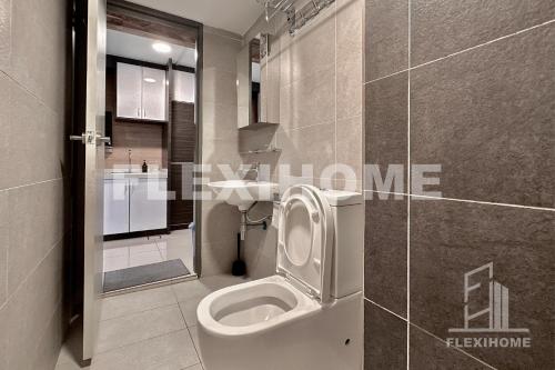 a bathroom with a toilet and a sink at NETFLIX-Pinnacle PJ, Fantastic City View, 1-6 Guests Designed Duplex Home by Flexihome-MY in Petaling Jaya