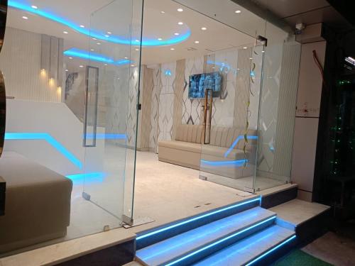a display case in a store with blue lights at Hotel Grand C & G at Central Delhi New Delhi in Jāmb