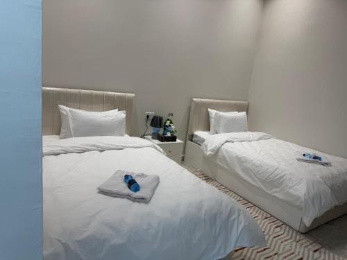 Ein Bett oder Betten in einem Zimmer der Unterkunft فلة الشروق - Sunrise Villa