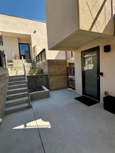 a entrance to a building with a door and stairs at Casita in Los Alamos
