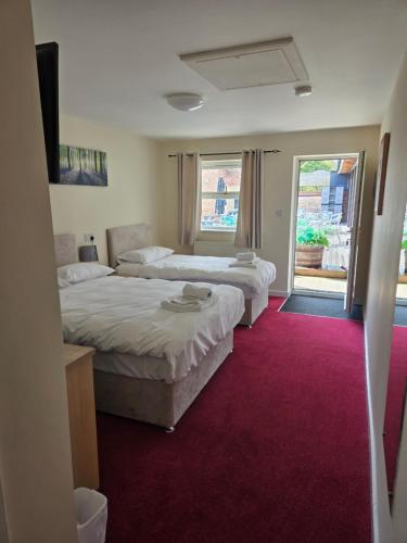 Postel nebo postele na pokoji v ubytování The Granby Rooms