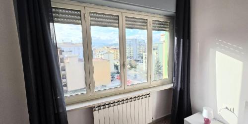 a window with a view of a city at Home Lazio 36 in Cosenza