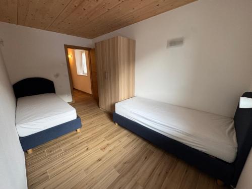 En eller flere senge i et værelse på Casa Vittoria