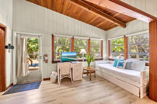 a bedroom with a bed and a desk with a computer at Oak Grove Escape with Shared Deck & Direct Beach Access in Englewood
