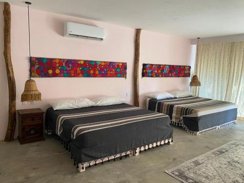 Postel nebo postele na pokoji v ubytování Cabañas y Restaurante La Luna