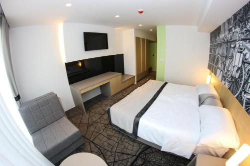a hotel room with a bed and a television at Hotel Grad in Sarajevo