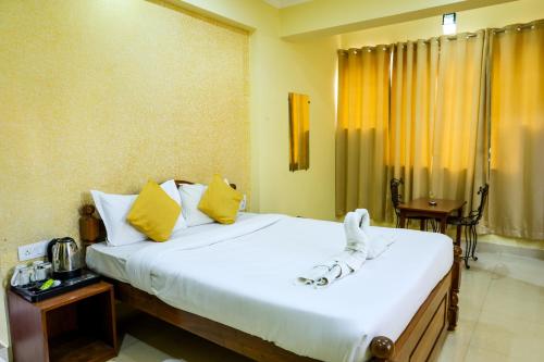 Ένα ή περισσότερα κρεβάτια σε δωμάτιο στο Hotel Baga Grande