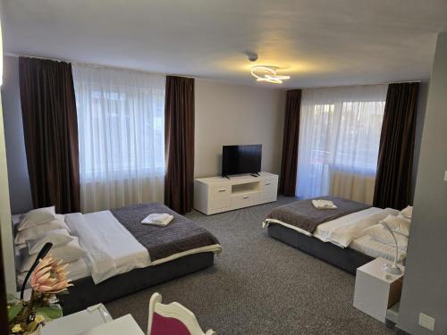 Ένα ή περισσότερα κρεβάτια σε δωμάτιο στο Hotel Delaf