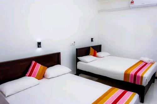 Ένα ή περισσότερα κρεβάτια σε δωμάτιο στο MK Yala Safari Cottage