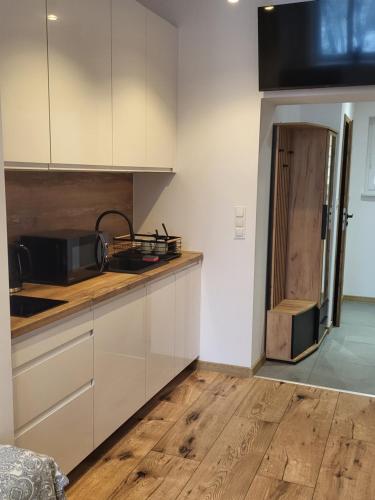 Kuchyň nebo kuchyňský kout v ubytování AS ELITE Apartament -Studio Centrum parking