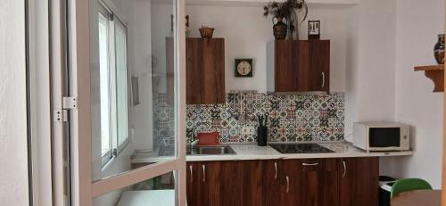 Kuchyň nebo kuchyňský kout v ubytování Casacuéntame