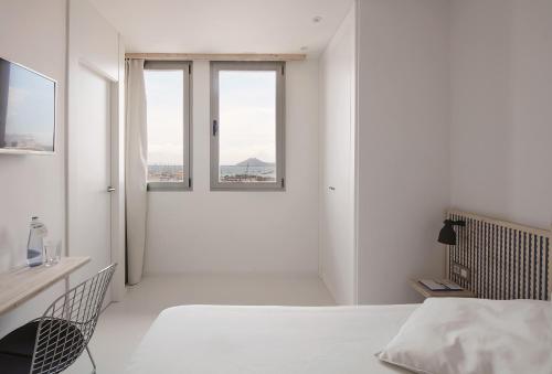 Postel nebo postele na pokoji v ubytování Hotel Eolo