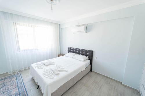 Ένα ή περισσότερα κρεβάτια σε δωμάτιο στο Villa Larisa