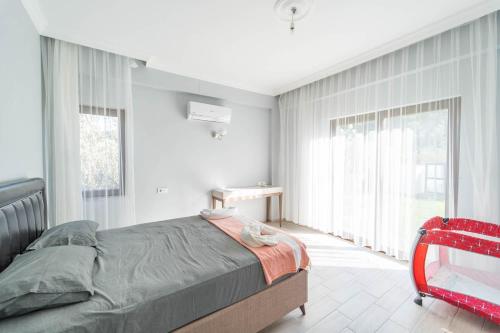 Ένα ή περισσότερα κρεβάτια σε δωμάτιο στο Villa Zara