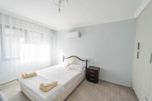 En eller flere senge i et værelse på Villa Albatros