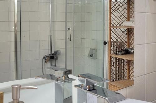a bathroom with a sink and a mirror at Toledo Downtown - Apartment for 6 in Toledo