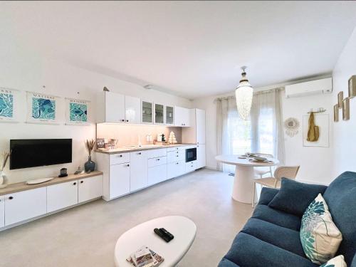 O bucătărie sau chicinetă la Douc Evasion - Appartement climatisé proche Montpellier, Parc Expo et Aéroport, avec parking sécurisé et accès rapide aux plages