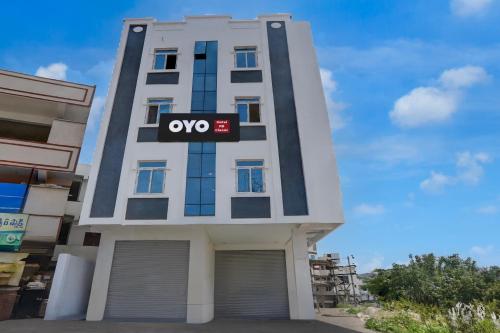 a building with an opioid sign on it at Super Hotel O RB Classic Inn in Kottapalli