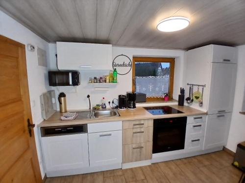 Η κουζίνα ή μικρή κουζίνα στο Ferienhaus Plech