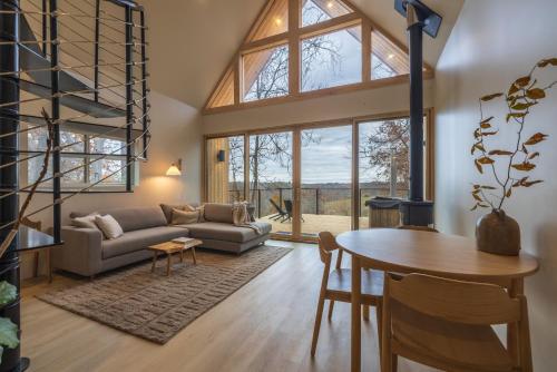 a living room with a couch and a table at The Ffern in Logan