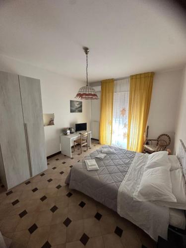 Ένα ή περισσότερα κρεβάτια σε δωμάτιο στο Casa Mimì