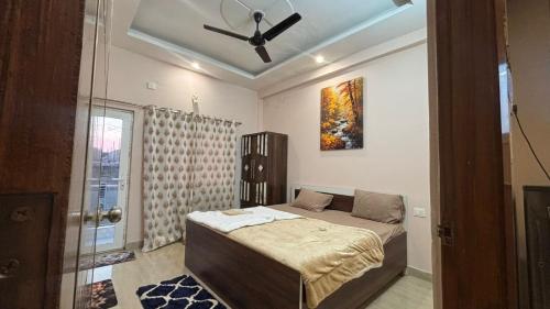 Ένα ή περισσότερα κρεβάτια σε δωμάτιο στο Infinium Stay