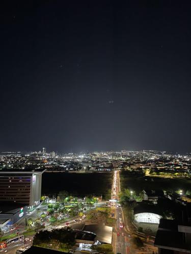 a view of a city at night with lights at Seller Residence Centro in Sobral