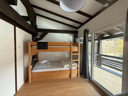 a bedroom with bunk beds in a tiny house at Ferienwohnung Leni in Siegsdorf