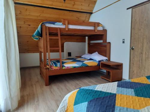 Ένα ή περισσότερα κρεβάτια σε δωμάτιο στο Cabañas El Girasol