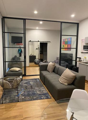 a living room with a couch and a table at Kasa Nápoles in Mexico City