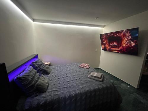 Ένα ή περισσότερα κρεβάτια σε δωμάτιο στο Cocoon Hyper Center