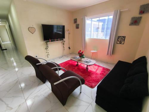 Μια τηλεόραση ή/και κέντρο ψυχαγωγίας στο Suite da praia