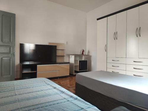 Postel nebo postele na pokoji v ubytování Casa espaço e aconchego