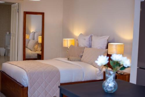 Ένα ή περισσότερα κρεβάτια σε δωμάτιο στο Haven Seven Property - 1 bedroom, 2 bedroom, 3 bedroom Executive options