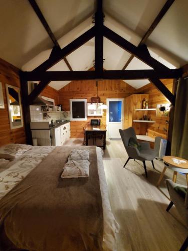 A bed or beds in a room at Les Cabanes de Rouffignac