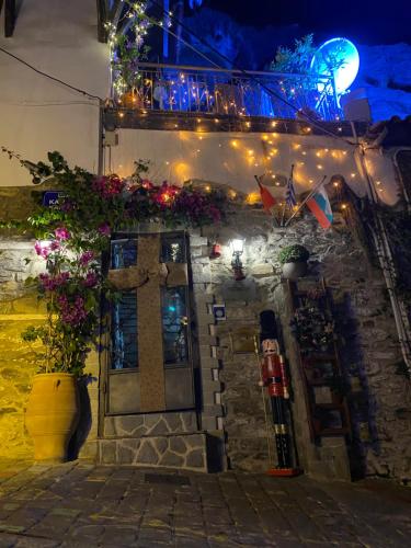 a building with a cross and lights on it at Villa Aurelia Old Town in Kavala