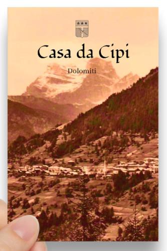 a book with a picture of a valley at Casa da Cipi in Venas