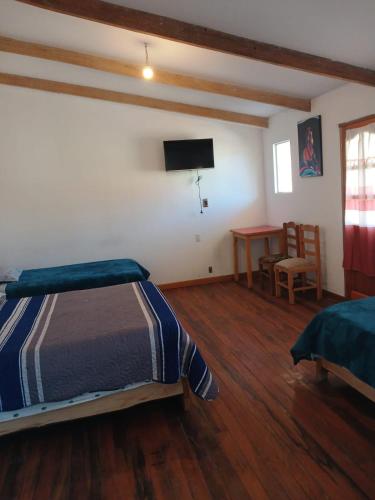 Ένα ή περισσότερα κρεβάτια σε δωμάτιο στο La Fábula-Amarilla