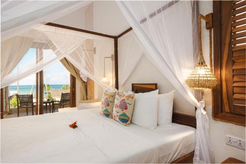 Ένα ή περισσότερα κρεβάτια σε δωμάτιο στο Mvuvi Boutique Resort