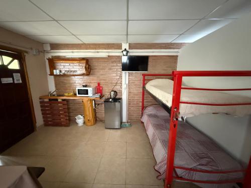 Küche/Küchenzeile in der Unterkunft Cabañas La Cautiva