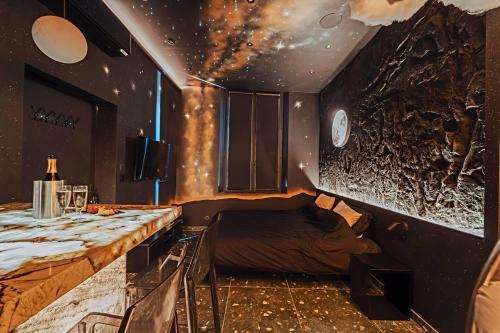 a room with a table and a bed in it at Suite Intemporelle in Montagnac