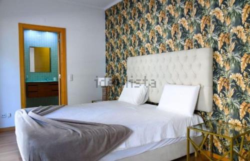 En eller flere senge i et værelse på Apartamento MARINA RESIDENCE