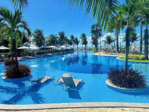 Πισίνα στο ή κοντά στο Viva o Paraíso – Condomínio Exclusivo Beira-Mar e Lazer Completo