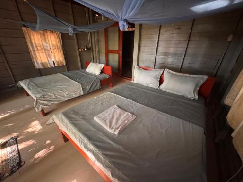 an overhead view of a bedroom with two beds at Prey Apsara Bungalows in Koh Rong