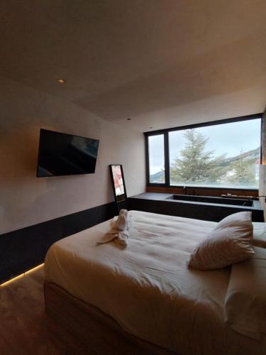 En eller flere senge i et værelse på Slalom luxury con vistas