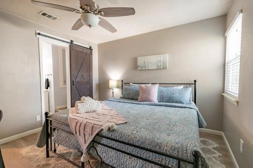 a bedroom with a bed with a ceiling fan at Nole Worries! in Tallahassee