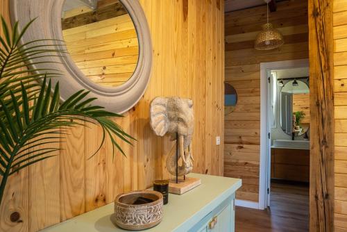 a room with a mirror on a wooden wall at casa Villa Escondida in Cádiz